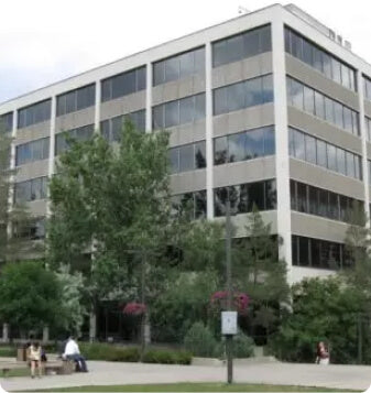 A multi-story office building with Mirage Series Window Film applied to the windows.