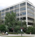 A multi-story office building with Mirage Series Window Film applied to the windows.