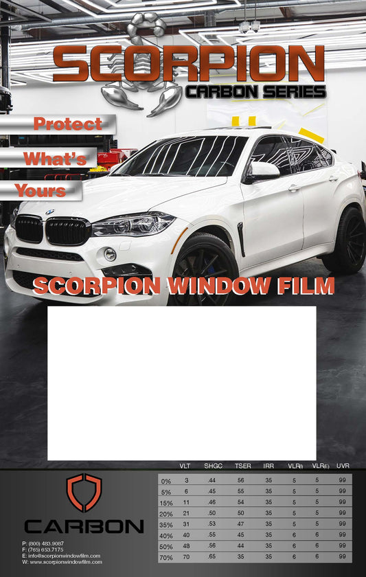 Advertisement on Carbon Metal Board for Scorpion Carbon Series window film on a car in a showroom.