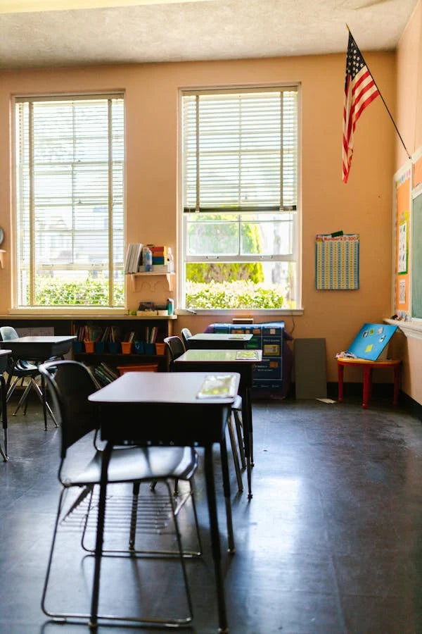 A classroom setting with window film applied to the windows, providing a view into the classroom but obscuring the details.