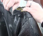 Man finishing a film instalation using the Scorpion Edge Cutting Steel Wire Tape
